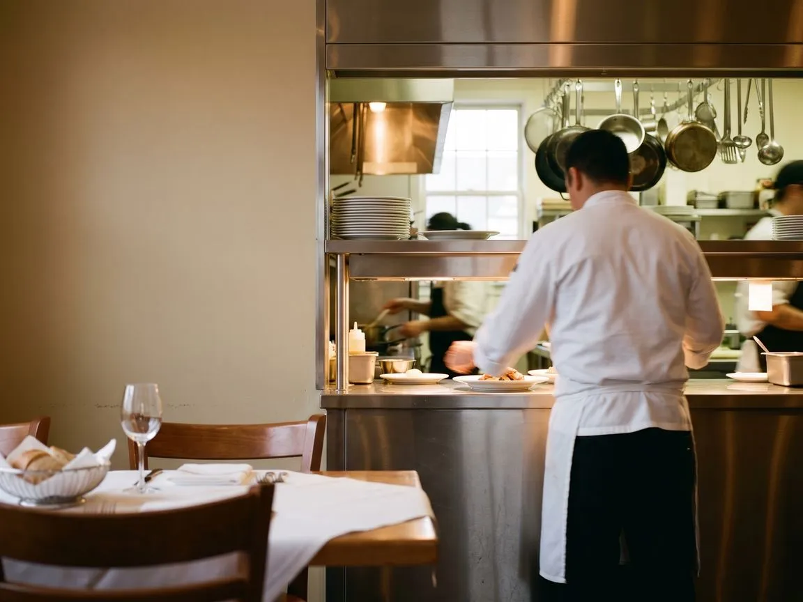 Restaurant kitchen with a chef at the pass-through window